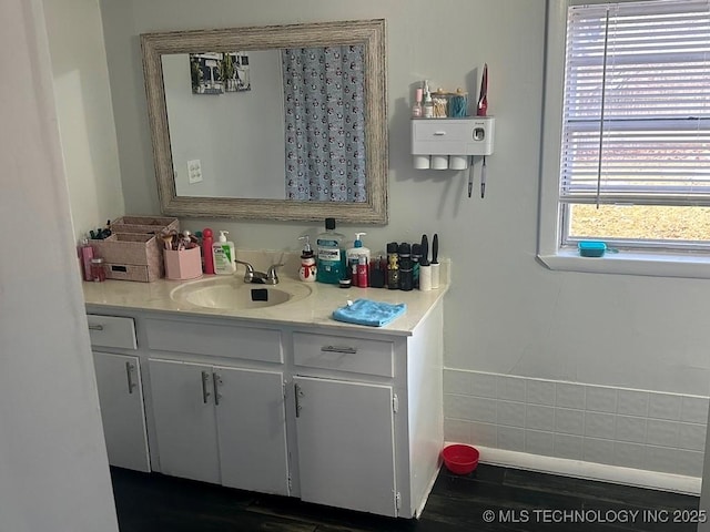 bathroom with vanity and hardwood / wood-style flooring