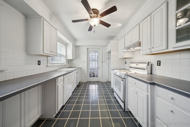 kitchen featuring tasteful backsplash, white appliances, ceiling fan, sink, and white cabinetry