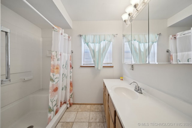 bathroom featuring a shower with shower curtain, vanity, and tile patterned floors