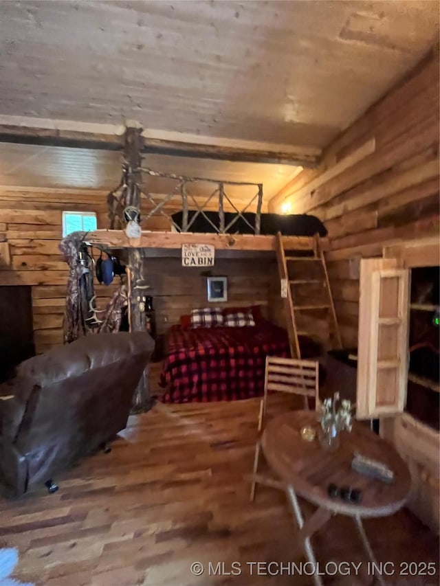 interior space with wooden ceiling, log walls, and hardwood / wood-style flooring