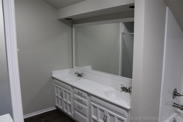 bathroom featuring vanity and hardwood / wood-style floors