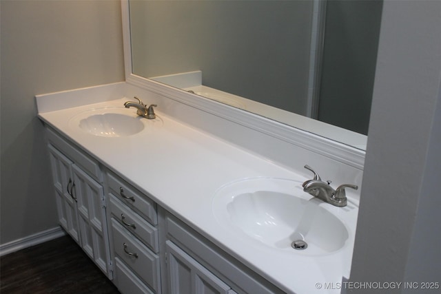 bathroom featuring vanity and hardwood / wood-style floors