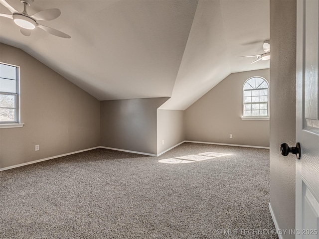 bonus room featuring ceiling fan, carpet floors, and lofted ceiling