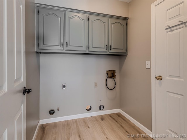 laundry room with electric dryer hookup, cabinets, gas dryer hookup, washer hookup, and light wood-type flooring