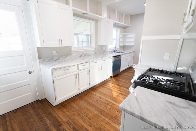 kitchen featuring black gas range, sink, stainless steel dishwasher, dark hardwood / wood-style floors, and white cabinetry