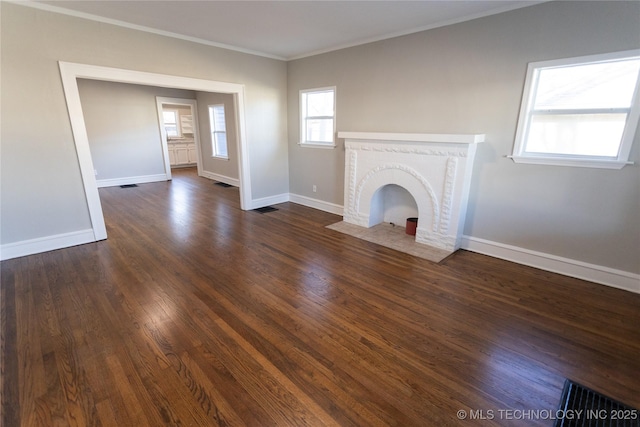 unfurnished living room with a fireplace, dark hardwood / wood-style floors, and crown molding