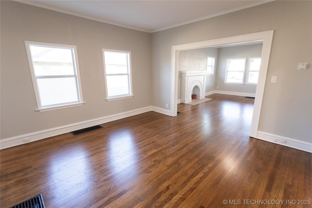 unfurnished living room with crown molding, a fireplace, and dark hardwood / wood-style floors