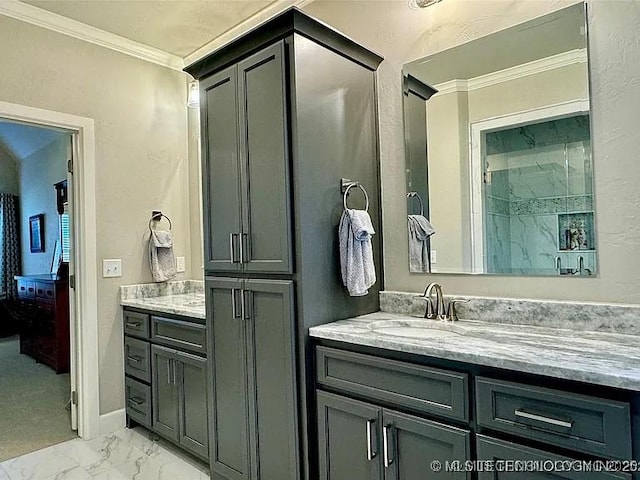 bathroom featuring crown molding and vanity