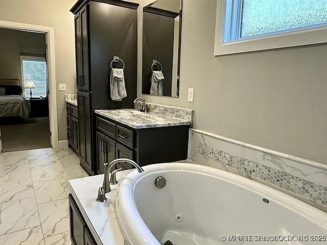 bathroom featuring vanity and a tub to relax in