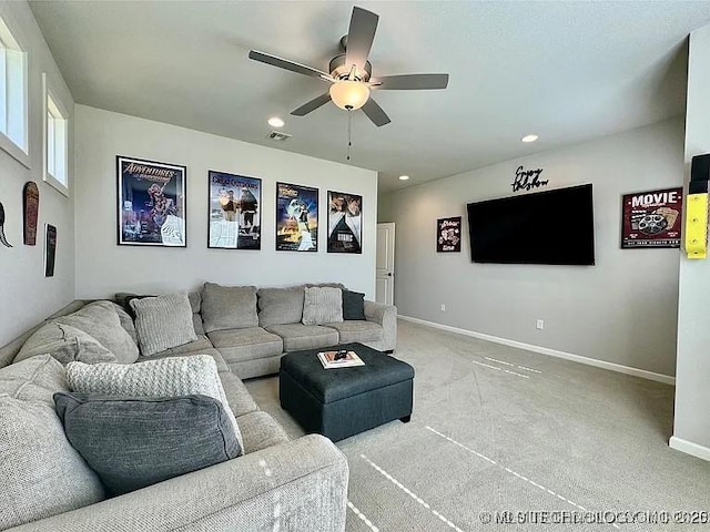 living room featuring light carpet and ceiling fan