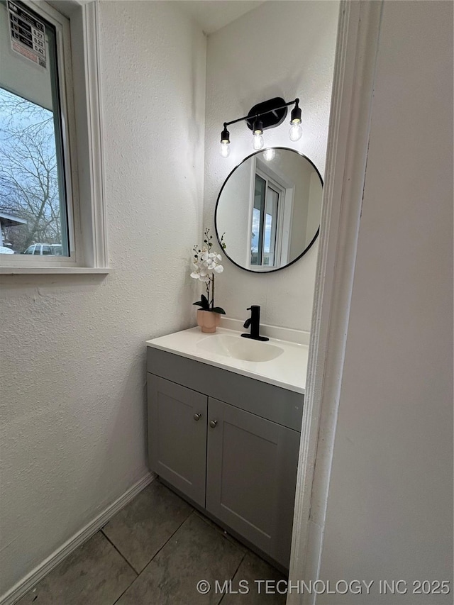 bathroom with vanity and tile patterned flooring