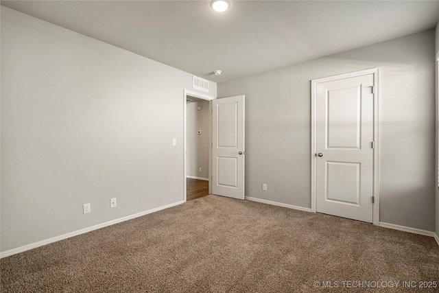 unfurnished bedroom with carpet flooring