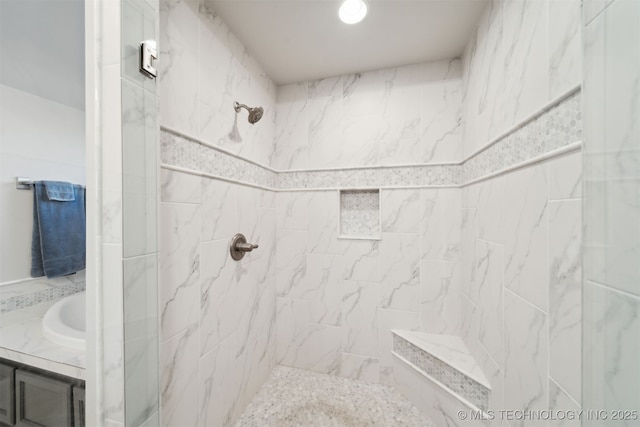 bathroom with tiled shower