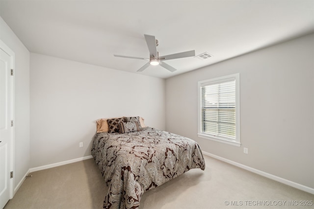 bedroom featuring ceiling fan and light carpet