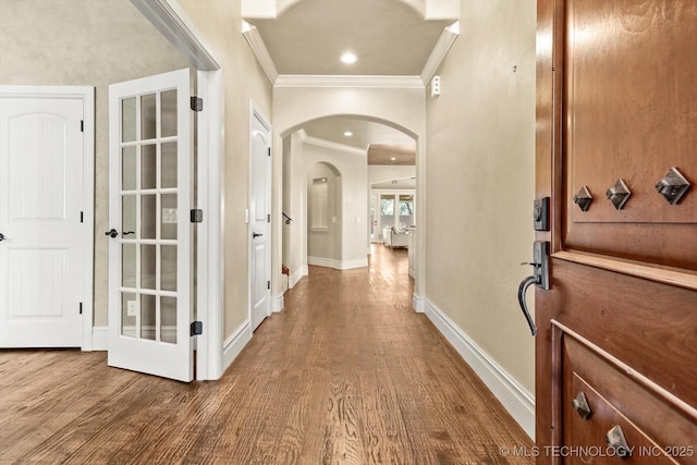 interior space featuring hardwood / wood-style flooring and ornamental molding