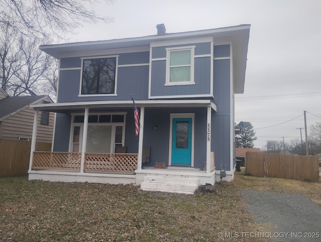 view of property featuring covered porch