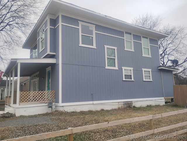 view of property exterior featuring covered porch