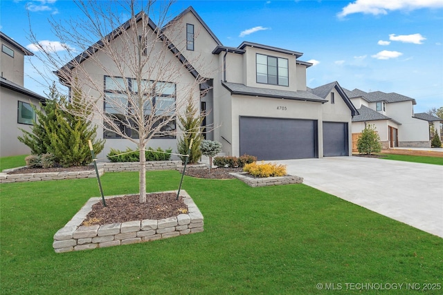 view of front of property featuring a garage and a front yard