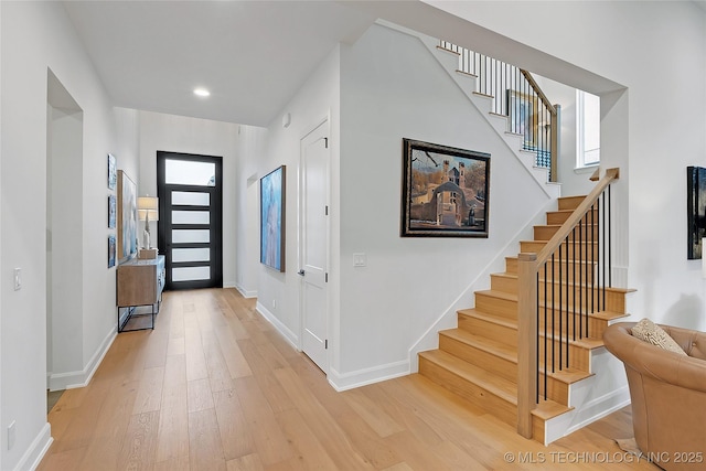 foyer featuring a healthy amount of sunlight and light wood-type flooring