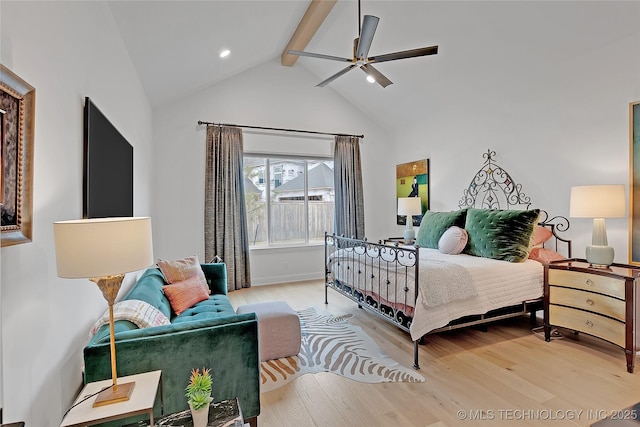 bedroom with wood-type flooring, beamed ceiling, high vaulted ceiling, and ceiling fan