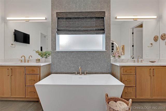 bathroom featuring a tub, decorative backsplash, and vanity