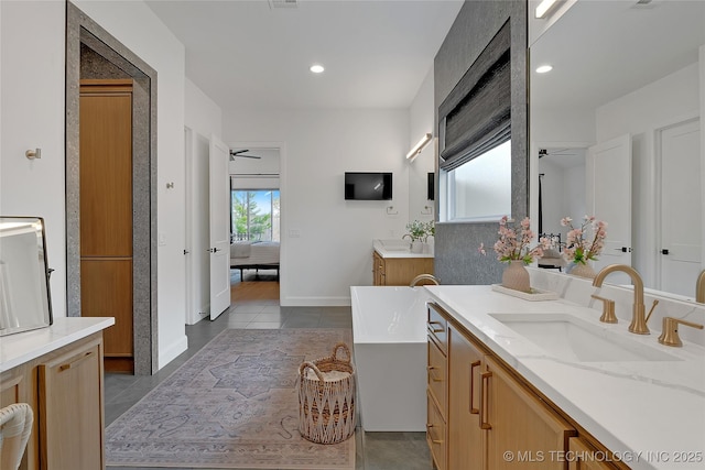 bathroom with vanity, ceiling fan, and tile patterned flooring