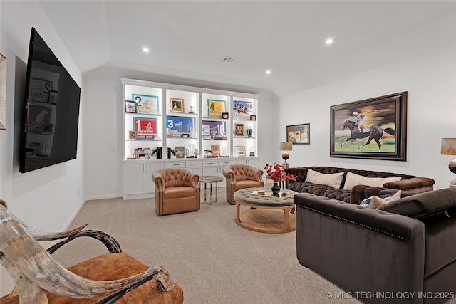 living room with light colored carpet and lofted ceiling