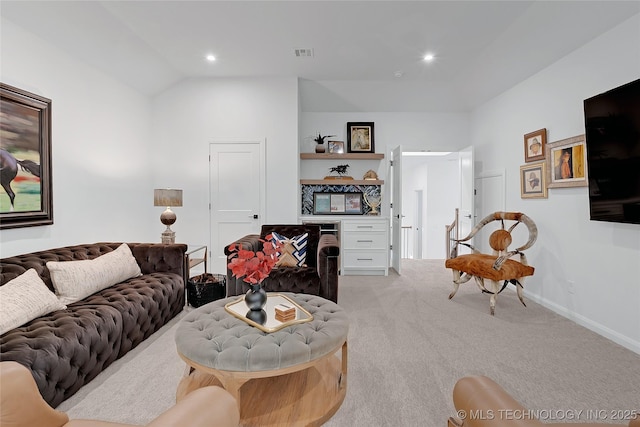 living room with light colored carpet and vaulted ceiling