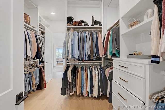 walk in closet featuring light hardwood / wood-style floors