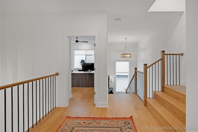 hallway featuring light hardwood / wood-style flooring