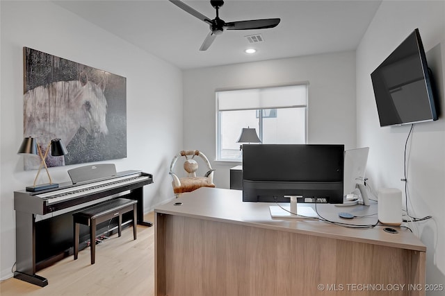 office space with light wood-type flooring and ceiling fan