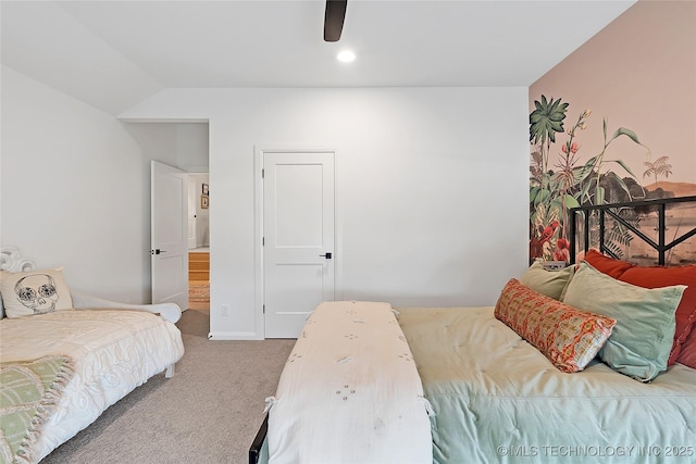 carpeted bedroom with vaulted ceiling and ceiling fan