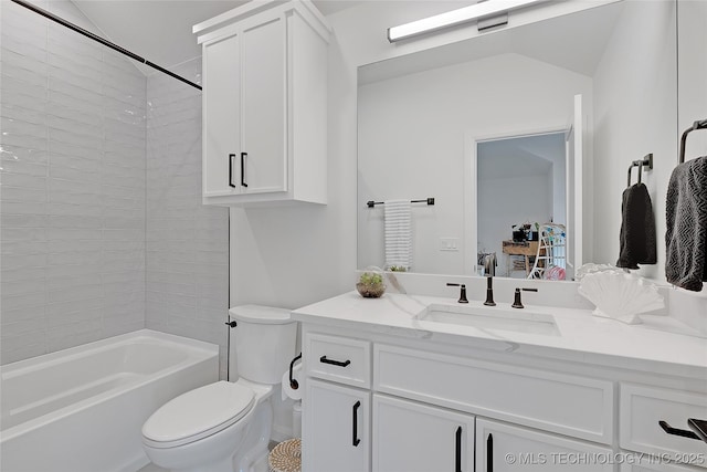 full bathroom with tiled shower / bath combo, toilet, and vanity