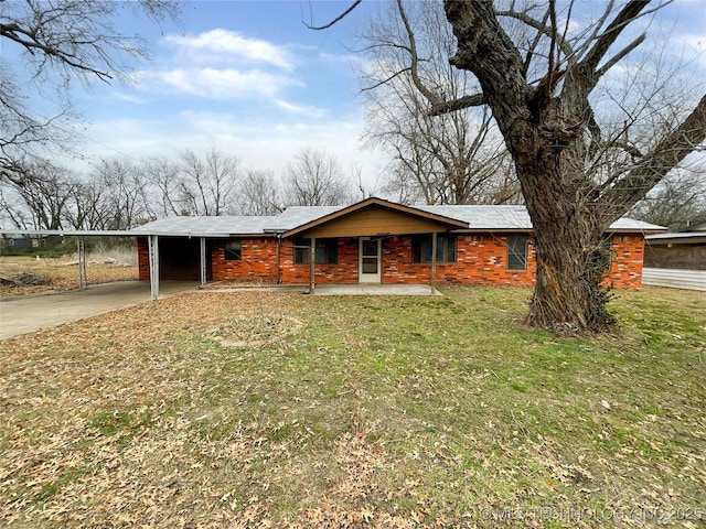 view of front facade with a carport and a front lawn