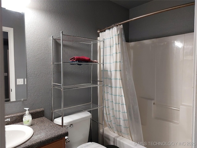 full bathroom featuring vanity, shower / bath combination with curtain, and toilet