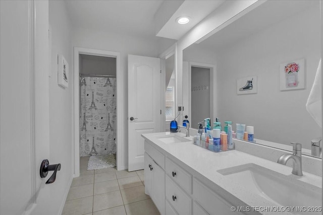 bathroom with tile patterned floors, walk in shower, and vanity