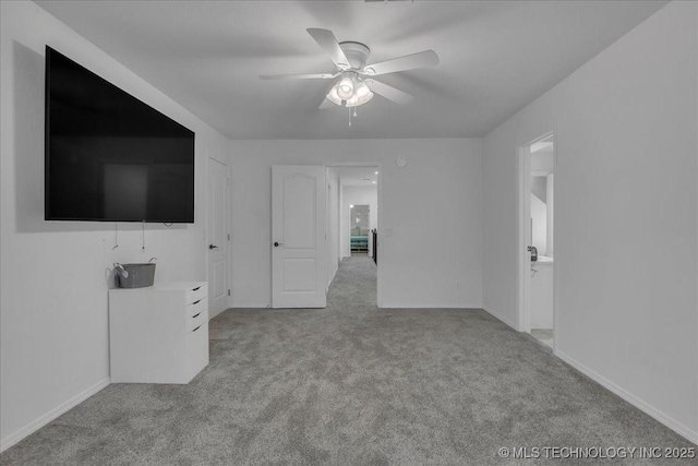 carpeted empty room with ceiling fan