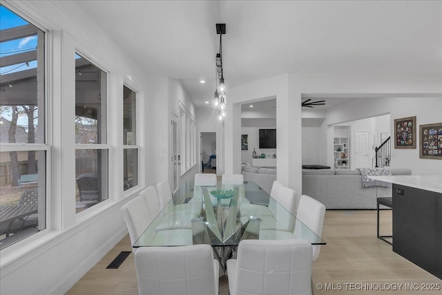 dining area featuring ceiling fan and light hardwood / wood-style floors