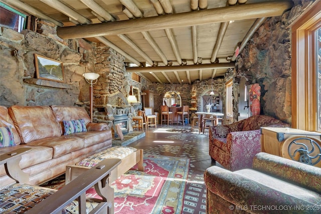 tiled living room with beam ceiling, a wood stove, plenty of natural light, and wooden ceiling