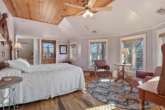 bedroom with ceiling fan, lofted ceiling, hardwood / wood-style flooring, wood ceiling, and ornamental molding