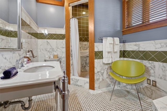 bathroom featuring a shower with shower curtain, tile walls, and tile patterned floors