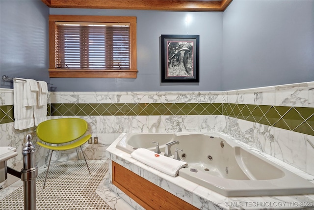 bathroom featuring a relaxing tiled tub and tile walls