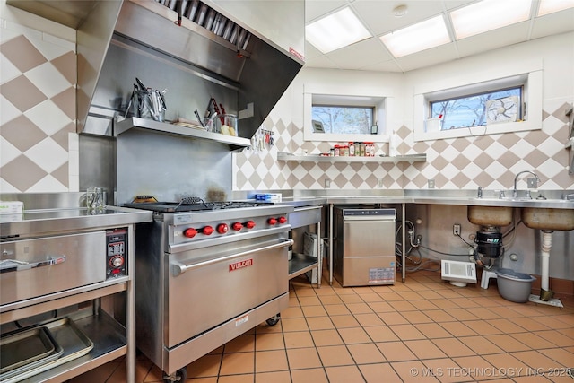 kitchen featuring stainless steel counters and luxury stove