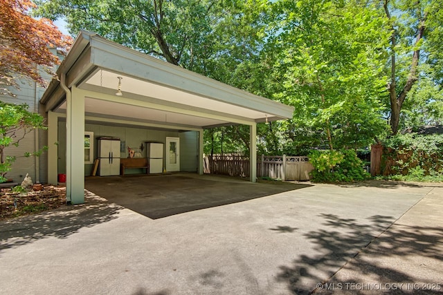 view of vehicle parking featuring a carport