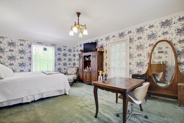 carpeted bedroom with an inviting chandelier and ornamental molding