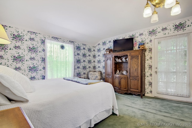 bedroom with a notable chandelier, carpet floors, and crown molding