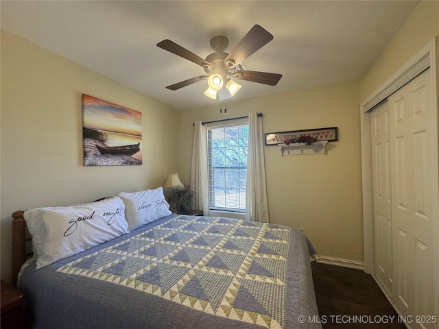 bedroom with ceiling fan and a closet