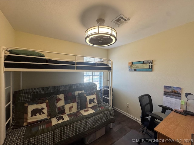 bedroom with dark wood-type flooring