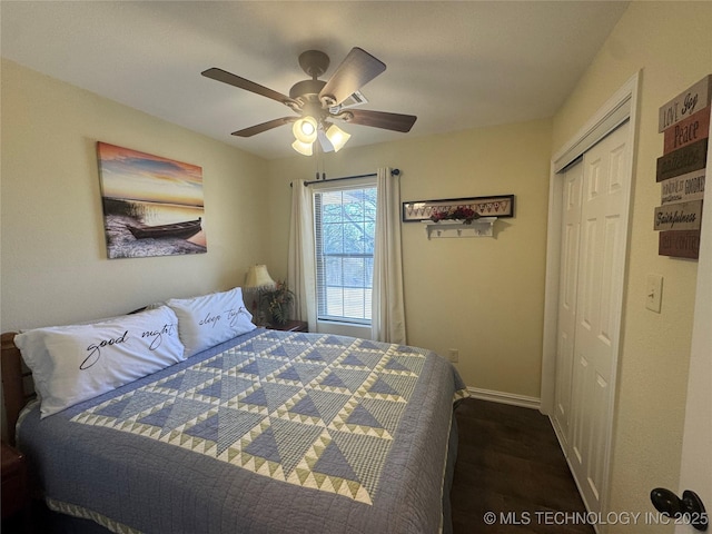 bedroom featuring a closet, ceiling fan, and dark wood-type flooring