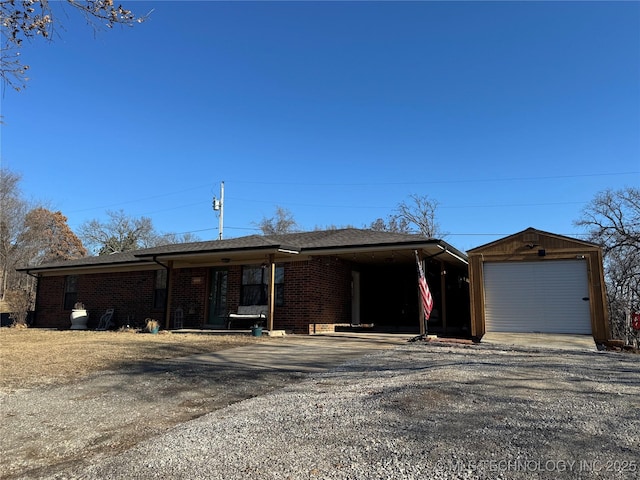 view of front of home with a garage and an outdoor structure